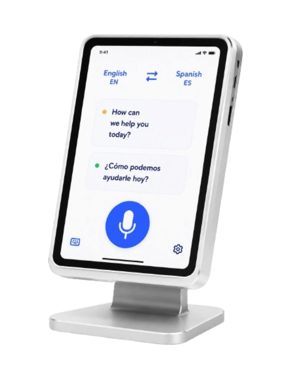 A tablet on a stand showing the Aiko app translating between English and Spanish.